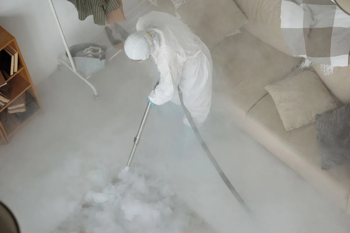 Biohazard cleanup technician in protective equipment, North Pembroke, MA